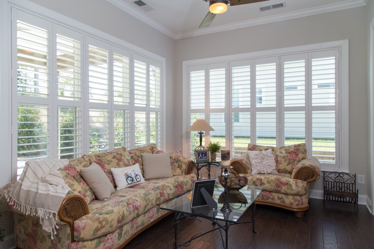 Traditional sunroom with interior shutters in San Diego.